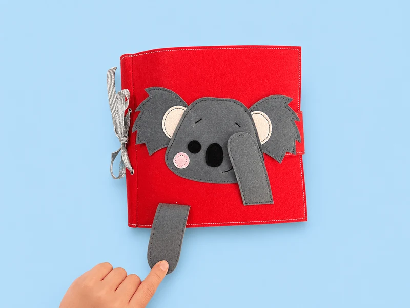 Nyfiken Koala - Upptagen bok med australiensiskt tema